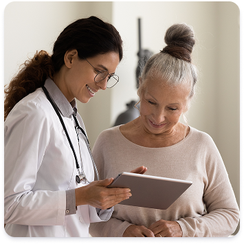 A photo of a physician speaking with a patient.