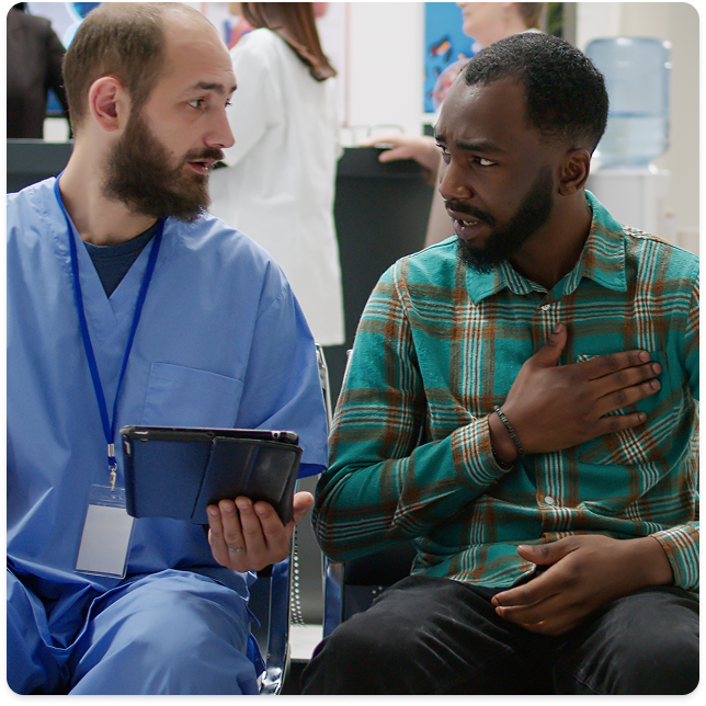 A photo of a physician speaking with a patient.